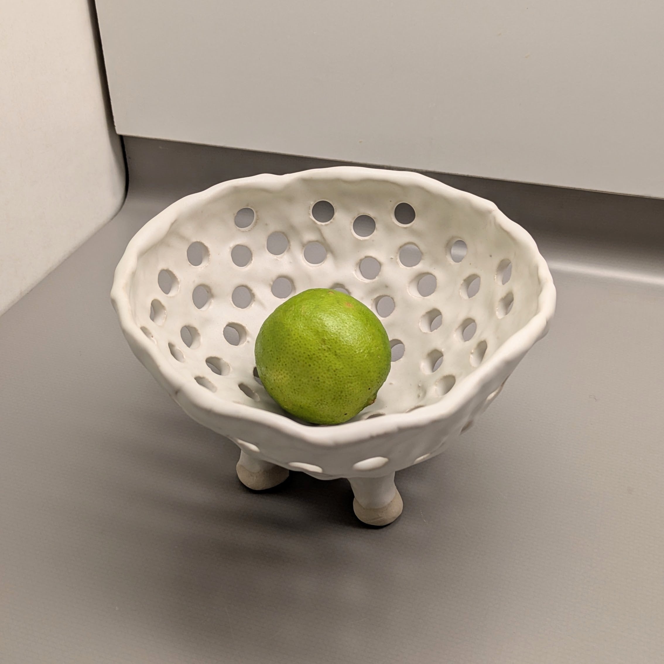 A. Mills Clay Colanders